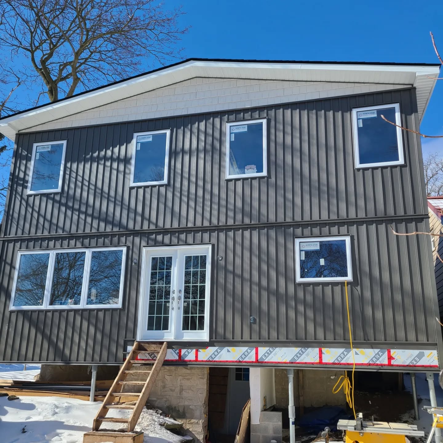 Large two-story addition with steel siding in Galt by Caliber Contracting